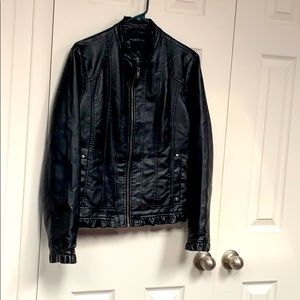 Black leather jacket with stitching details.
